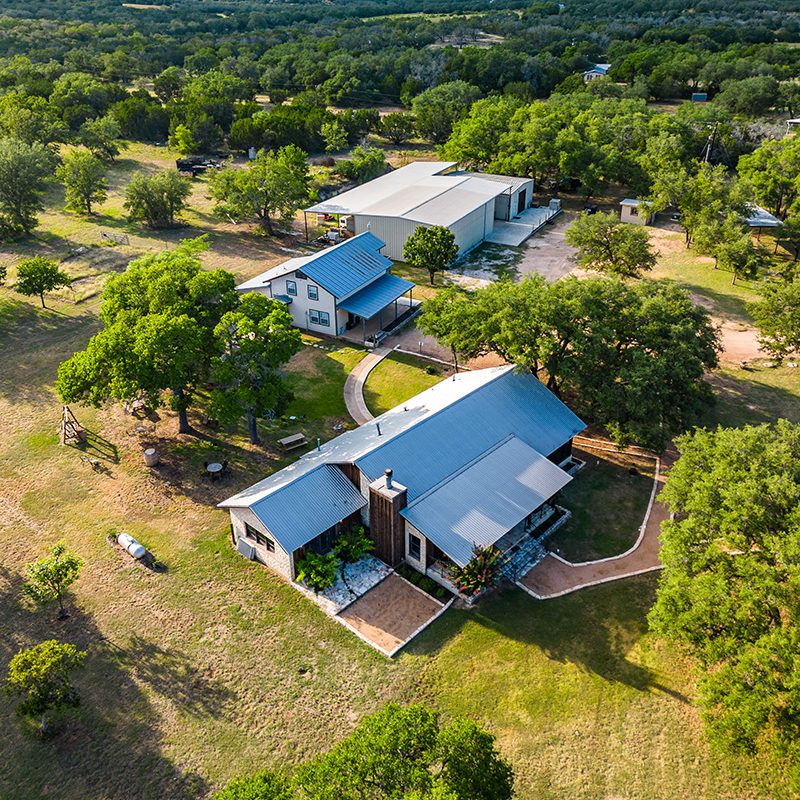 aerial view of the westcave cellars winery & brewery property in johnson city, texas.